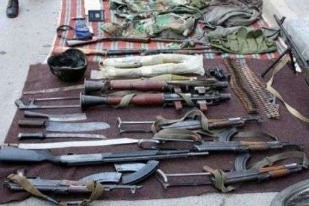 The Syrian Army displays weapons seized from armed gangs in the town of Jisr al-Shughour, north of the capital Damascus, on June 13, 2011.