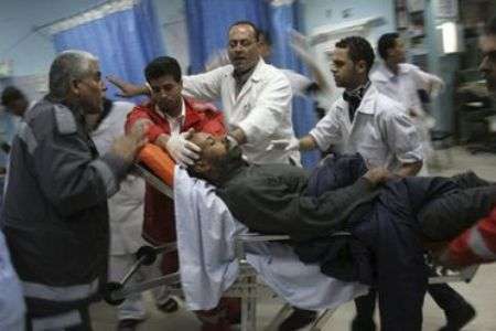 A Palestinian is carried into al-Aqsa Martyrs Hospital in the central Gaza Strip town of ‎Deir al-Balah, injured in an Israeli attack, file photo
