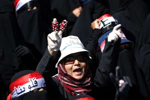 A Yemeni woman and anti-government protester shout slogans during a demonstration demanding the trial of Yemeni President Ali Abdullah Saleh in Sanaa
