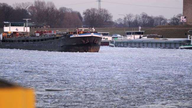 A barge lays on the border of a frozen river in the harbor of Duisburg, western Germany, on February 8, 2012.