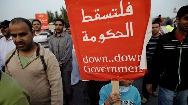 Bahraini protesters take part in an anti-government rally in Bilad al-Kadim, a suburb of Manama, on February 24, 2012.