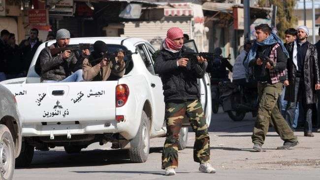 Syrian rebels are seen in the centre of Idlib, northwestern Syria, February 24, 2012.