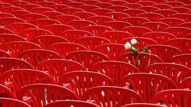 Empty red chairs to commemorate 11,541 Bosnian war victims
