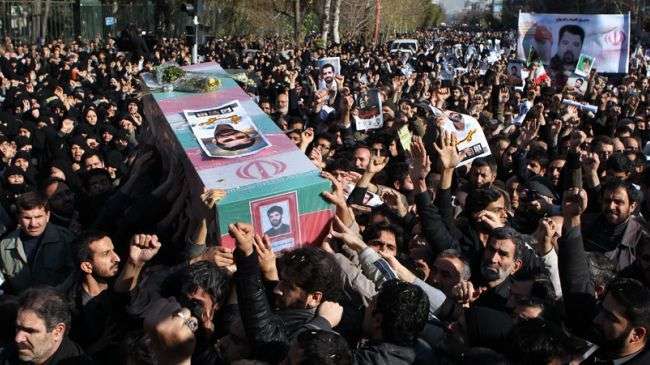 People carry the coffin of nuclear scientist Mostafa Ahmadi Roshan during his funeral after the Friday prayers outside Tehran University, Iran, January 13, 2012.
