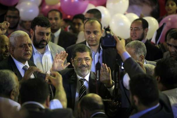 Mohamed Morsi waves to his supporters during a campaign in Cairo. Egyptians will vote on May 23 and 24 in the first presidential election since Hosni Mubarak’s ouster.