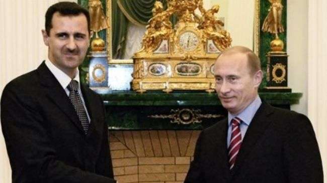 File photo of Syrian President Bashar al-Assad (L) and his Russian counterpart Vladimir Putin