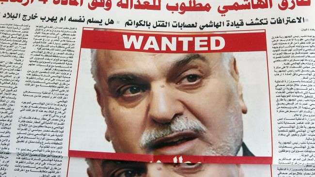 File photo of an Iraqi newspaper with the picture of fugitive Vice President Tariq al-Hashemi