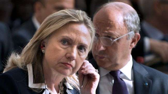 US Secretary of State Hillary Clinton (L) and French Foreign Minister Laurent Fabius listen during a meeting of the so-called "Friends of the Syrian People" at the MFA Conference Center in Paris on July 6, 2012.