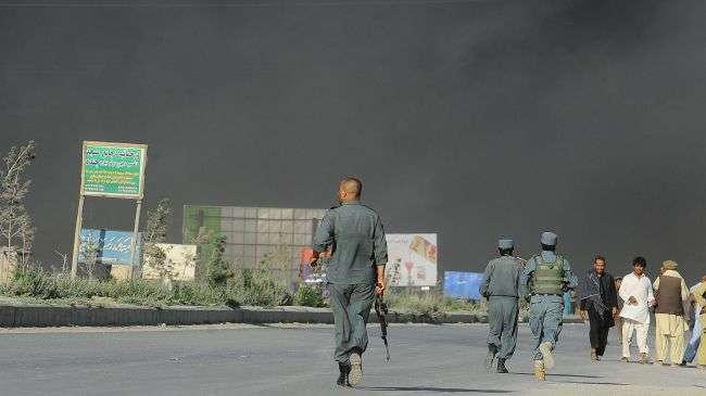 Afghan troops react following an explosion at a warehouse in Kabul, July 4, 2012.