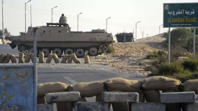 Egyptian security forces secure an area in al-Kharuba village on the Sinai Peninsula, August 19, 2011.