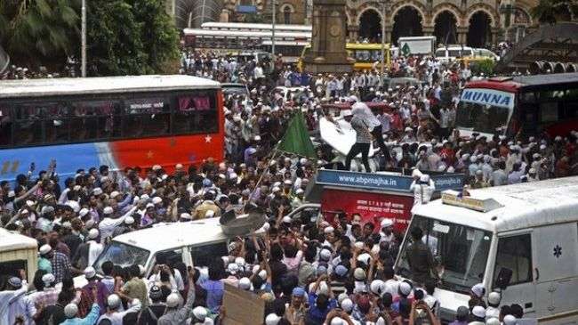 Protesters in Mumbai block traffic during a demonstration against the deaths of Muslims in recent violence in Assam, India, on August 11, 2012.