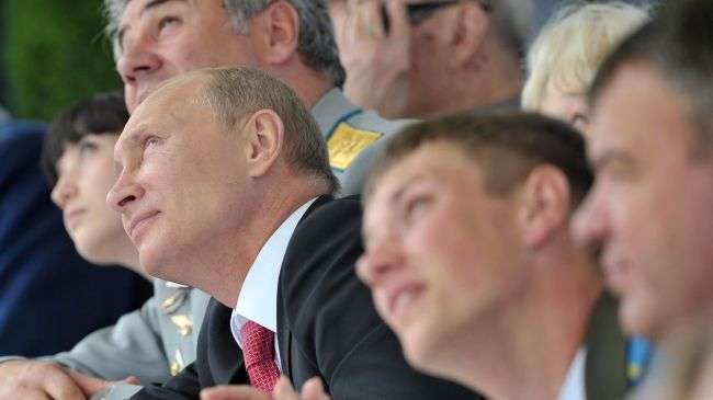 President Vladimir Putin watches an air show outside of Moscow on August 11.