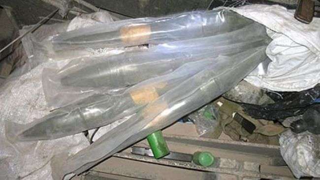 A file photo shows mortar rounds, rockets, and rocket propelled grenade rounds in packaging.