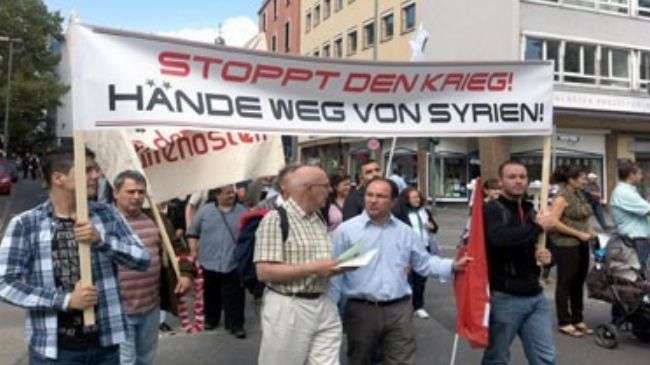 Syrian expatriate protest against a possible foreign military intervention in their country during a rally in Frankfurt, Germany on September 1, 2012.