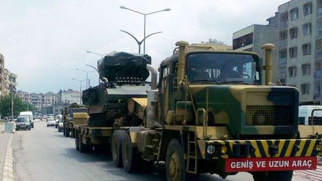 Turkish military trucks carry missile batteries in the southern province of Hatay on June 28, 2012.
