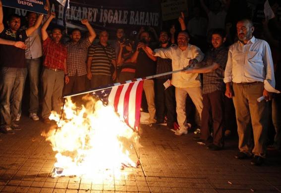 Protesters burn a U.S. flag during a protest against a film produced in the U.S. that they said that was insulting to the Prophet Mohammad in Istanbul September 14 2012.