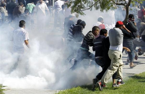 Protesters run for cover during a demonstration in front of the U.S. Embassy in Tunis September 14 2012.