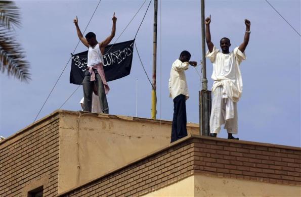 Sudanese demonstrators climb up the roofs of the German embassy in Khartoum after Friday prayers September 14 2012.