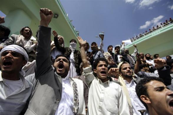 Protesters shout anti-U.S. slogans during a demonstration at a crossroad leading to the U.S. embassy in Sanaa September 14 2012.