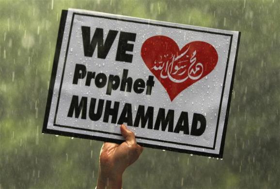 A Muslim demonstrator holds up a sign during a protest in front of the U.S. embassy in Bangkok September 18 2012.