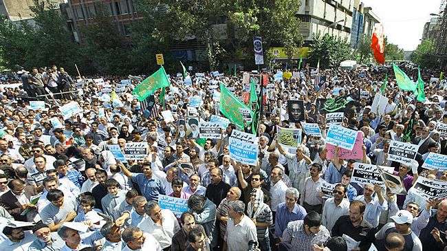 Iranian students stage rally in front of the Swiss Embassy in the Iranian capital city, Tehran, on September 13, 2012 to condemn the US-made anti-Islam movie.