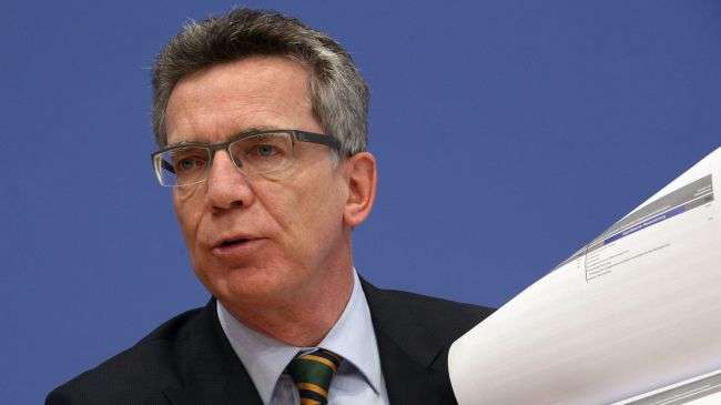 German Defence Minister Thomas de Maiziere addresses a press conference in Berlin on October 26, 2011.
