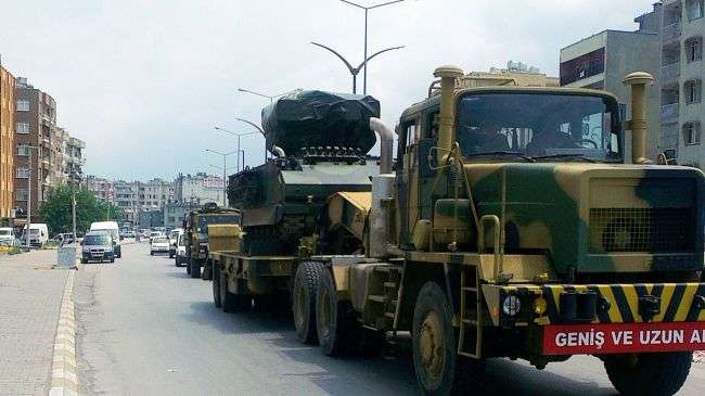 Turkey is sending missile batteries and army vehicles to the border with Syria.