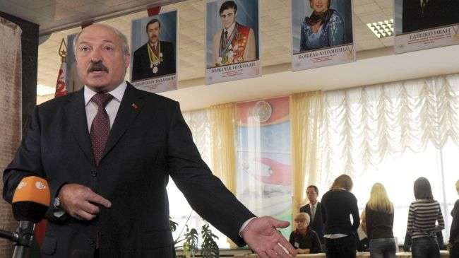 Belarus President Alexander Lukashenko speaks to journalists after voting in Minsk on September 23, 2012.