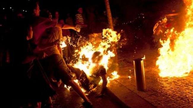 An Israeli protester sets himself on fire.