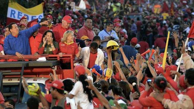 Venezuelan President Hugo Chavez waves to supporters in Barquisimeto, Lara state, October 2, 2012.