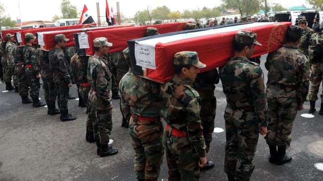 Syrian troops in the capital Damascus carry the coffins of comrades killed during the unrest in the country.
