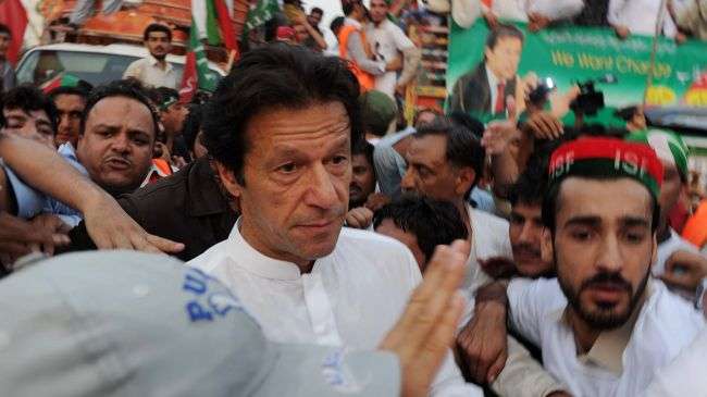 Chairman of Pakistan Tehreek-e-Insaf Imran Khan arrives for a protest rally against the reopening of the NATO supply route to Afghanistan, in Peshawar on July 14, 2012.