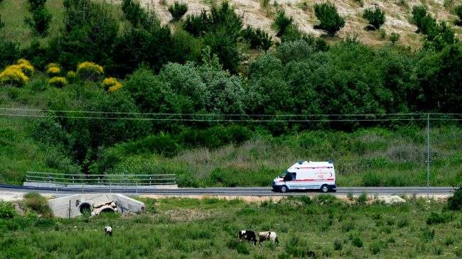 A Turkish ambulance travels near the city of Hatay at the border with Syria.
