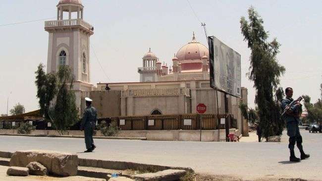 Afghan security forces in Kandahar Province stand
guard in front of a mosque