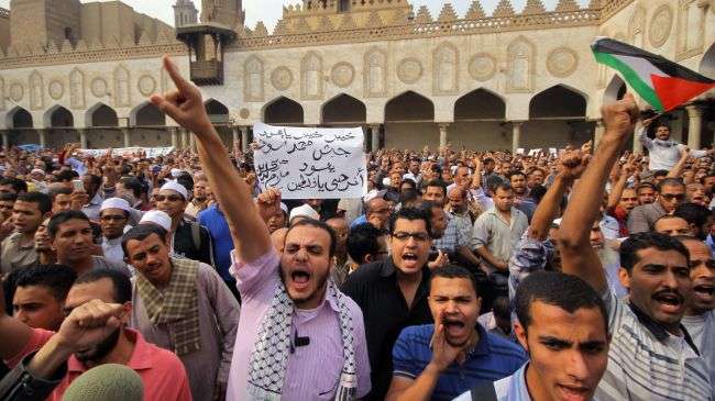 Egyptian demonstrators shout anti-Israeli slogans during a demonstration in Cairo on November 16, 2012.