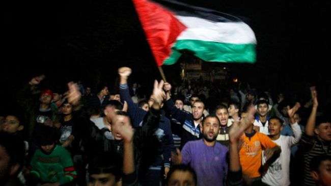 Palestinians cheer as their UN bid is approved.