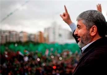Hamas chief Khalid Mashaal gestures to the crowd during a rally marking the 25th anniversary of the founding of Hamas, in Gaza City December 8, 2012.