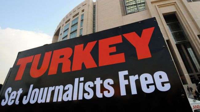 A placard is pictured during a protest by journalists and human right activists in front of the courthouse in Istanbul during the trial of two prominent Turkish journalists.