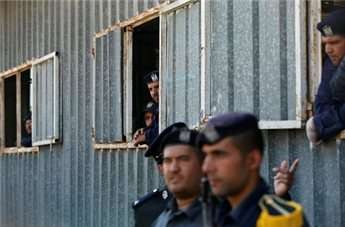 Palestinian police watch a graduation ceremony for the Hamas security forces in Gaza City Jan. 3, 2013.