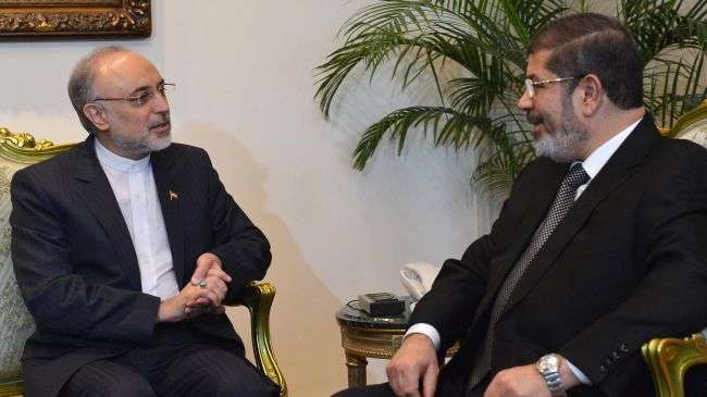 Iranian Foreign Minister Ali Akbar Salehi (L) speaks with Egyptian President Mohamed Morsi at the presidential palace in Cairo.