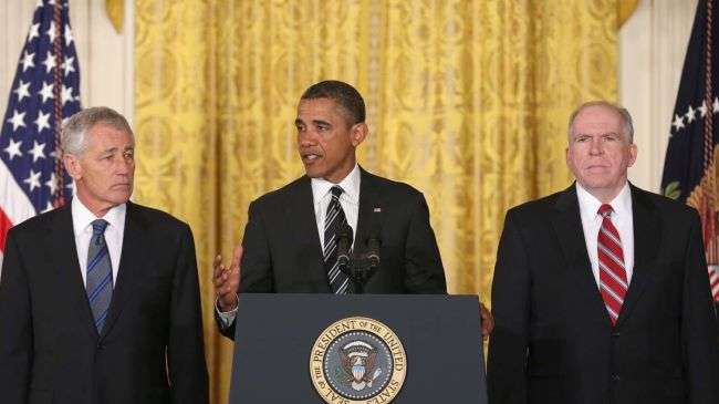 US President Barack Obama (C) speaks during a news conference with chief counterterrorism adviser John Brennan (L), and former US Sen. Chuck Hagel at the White House in Washington, DC, January 7, 2013.