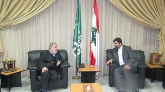 Iran’s Ambassador to Beirut Ghazanfar Roknabadi (R) and Secretary General of al-Jamaa al-Islamiya Ibrahim al-Masri meet in Beirut on January 11, 2013.