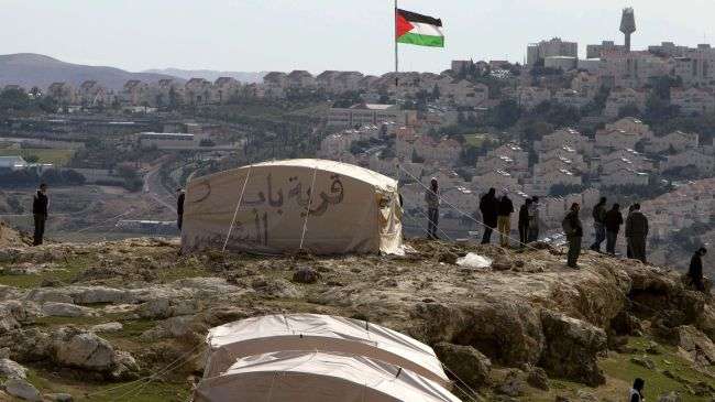 Palestinian activists set up tents in an area of the occupied West Bank on January 11, 2013.