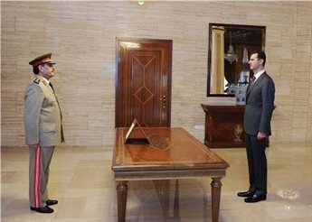 Fahad al-Freij is sworn in as Defense Minister by Syrian President Bashar Assad in Damascus.