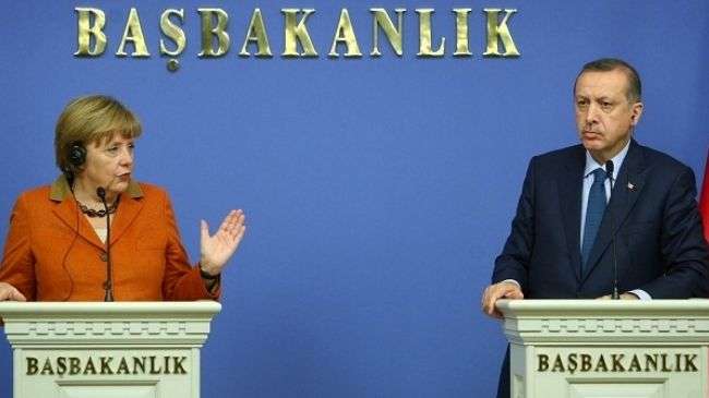 German Chancellor Angela Merkel (left) and Turkish Prime Minister Recep Tayyip Erdogan (right) attend a joint news conference in Ankara on February 25, 2013.