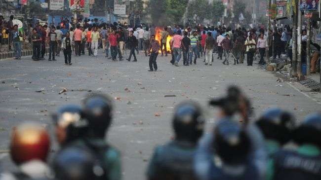 Anti-government protesters stand off against police in Dhaka, Bangladesh, on March 11, 2013.