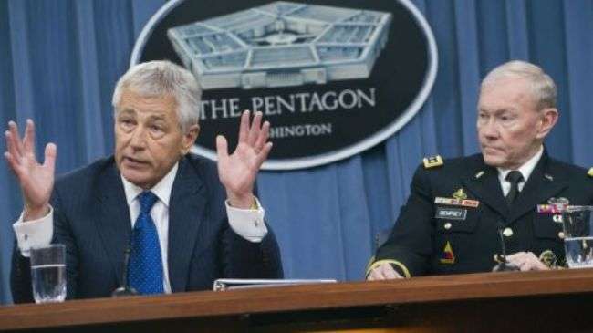 US Secretary of Defense Chuck Hagel (L) and Chairman of the Joint Chiefs of Staff General Martin Dempsey address a press conference on April 10, 2013.