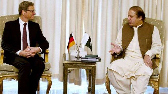 German Foreign Minister Guido Westerwelle (left) listens to Pakistani Prime Minister Nawaz Sharif during a meeting in Islamabad on June 8, 2013.