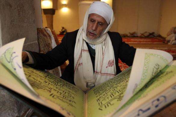A man reads the Quran in a mosque during the Muslim holy fasting month of Ramadan in Sanaa July 10 2013.