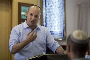 Naftali Bennett talks to students at a pre-military religious school, north-east of Ashkelon on January 20, 2013.
